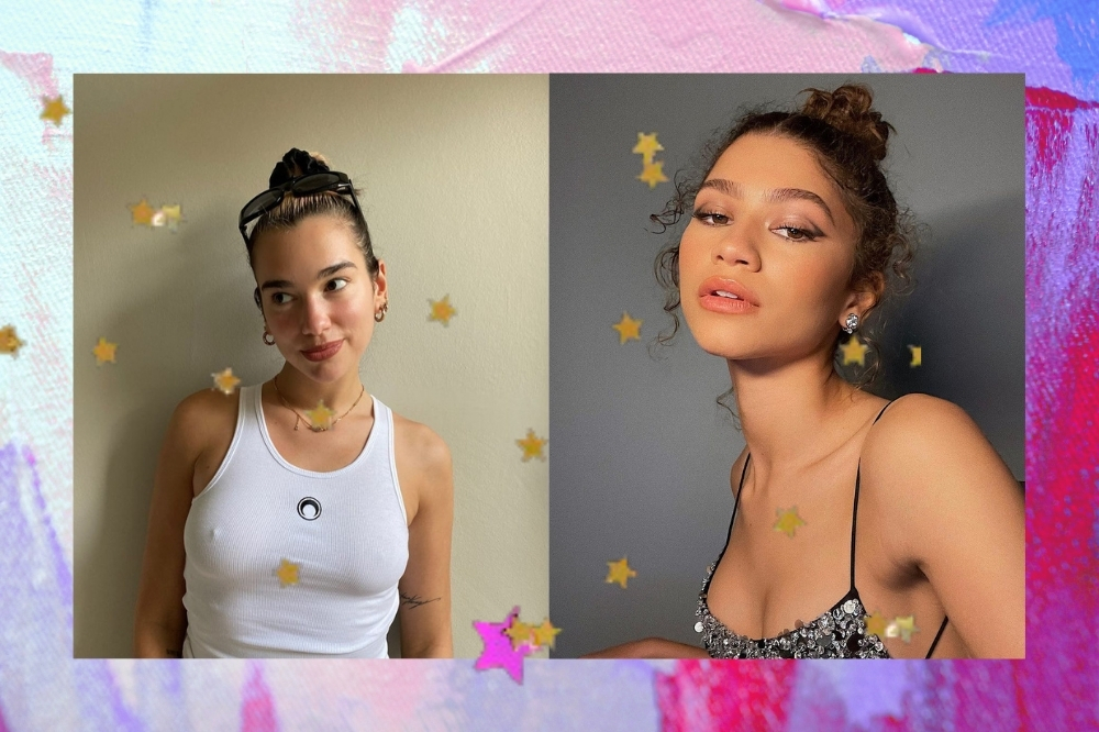 Montagem com a cantora Dua Lipa e a atriz Zendaya, com o fundo azul e roxo com estrelinhas coloridas. A Dua Lipa veste um top branco e está com o cabelo preso. A Zendaya veste um top preto com brilhos pratas. A Dua olha para o lado e sorri, a Zendaya olha para a câmera mas não sorri.