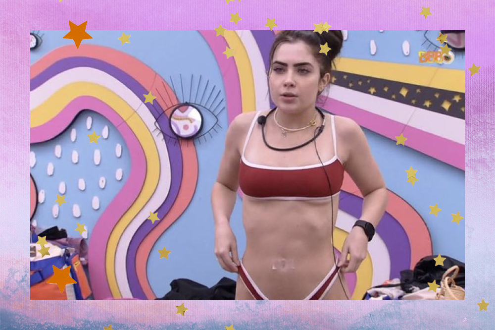 Jade Picon de bíquini e com o umbigo tampado no quarto Lollipop do BBB22; a margem é uma textura degradê nas cores rosa, branco, lilás, roxo e azul com estrelas amarelas e laranjas decorando a imagem