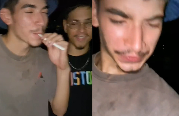 Jovem confunde teste de gravidez com vape e “fuma xixi” Prints de um menino, com bigode e bucket hat, vaporizando sem querer um teste de gravidez e depois com cara de nojo ao perceber que