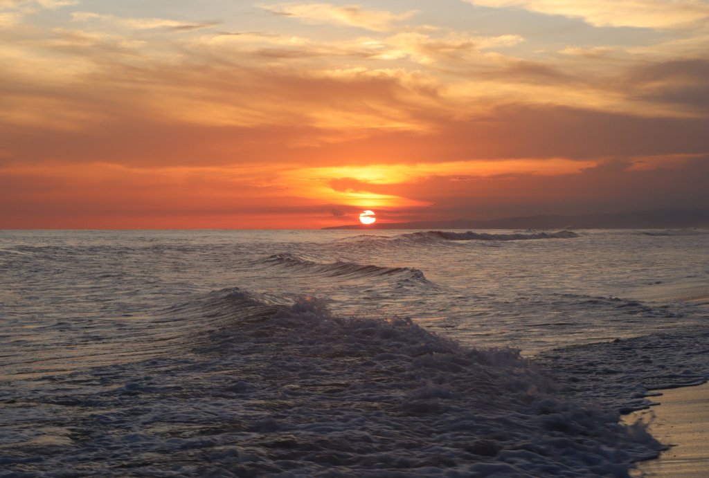 Imagem de um por do sol na praia